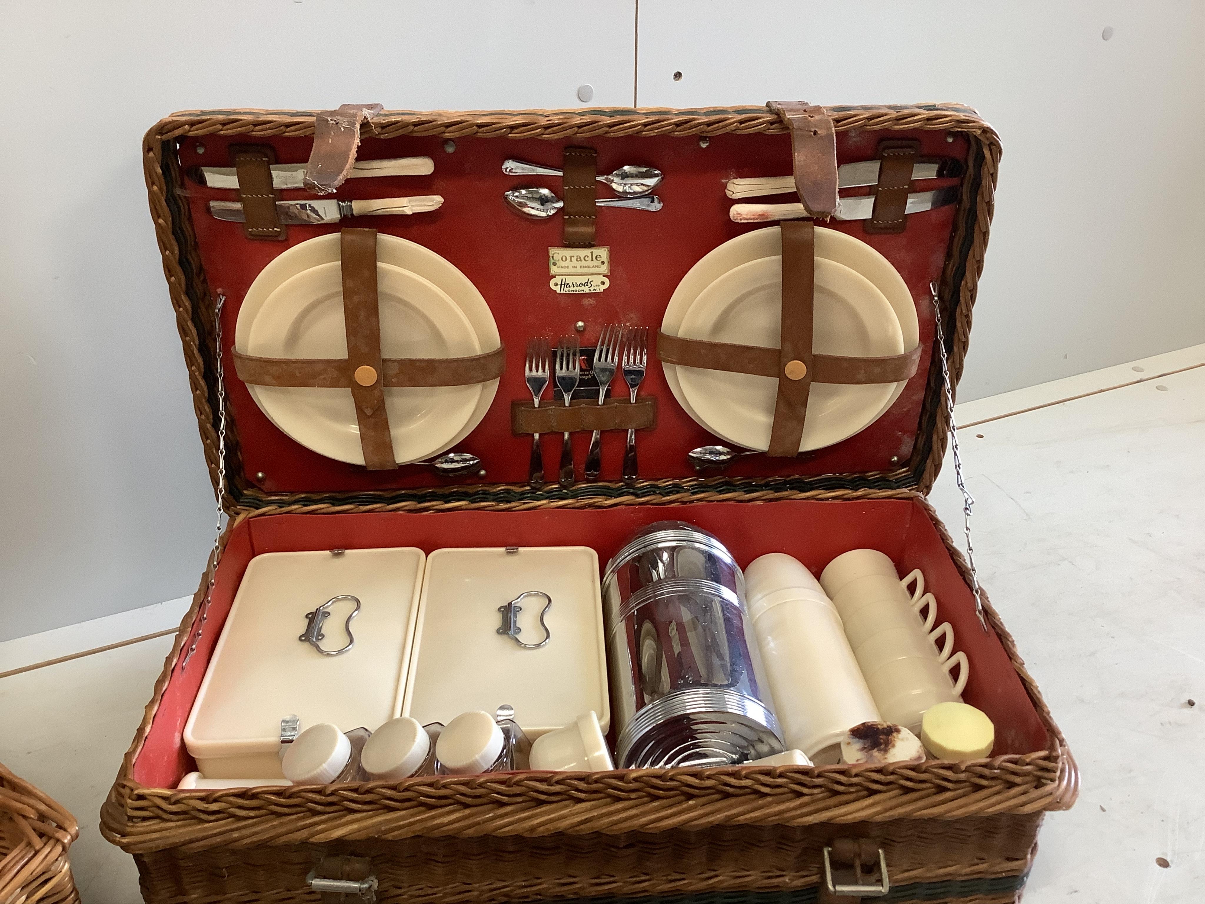 Two vintage picnic hampers with contents, larger width 64cm, depth 35cm, height 21cm. Condition - fair